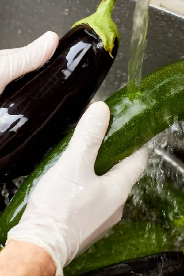 Washing vegetables after being sprayed with hot pepper spray
